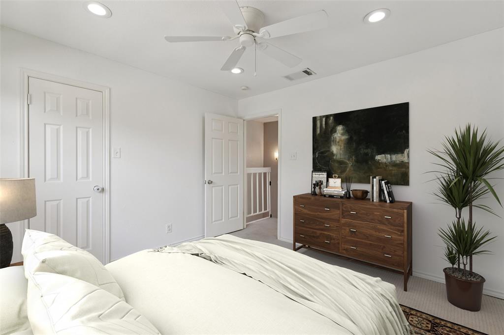 5200 Martel Avenue, Unit 36A Dallas, TX 75206 - Photo 19 of 34 a bedroom with a large bed and a flat tv screen on dresser