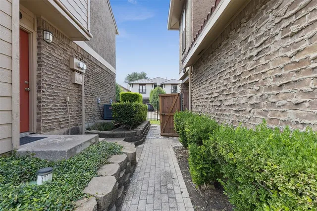 a view of a pathway both side of house