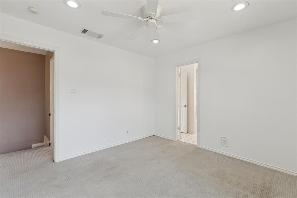 5200 Martel Avenue, Unit 36A Dallas, TX 75206 - Photo 22 of 34 an empty room with an entryway and fan