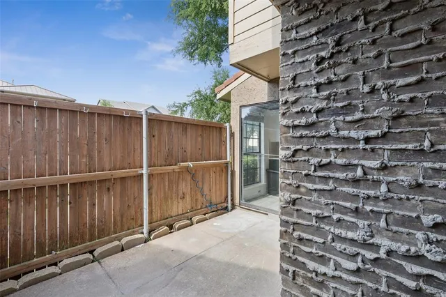 a view of a backyard with sitting area and furniture