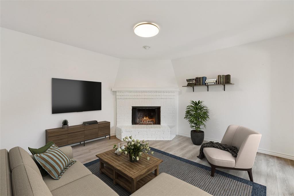 5200 Martel Avenue, Unit 36A Dallas, TX 75206 - Photo 4 of 34 a living room with furniture a fireplace and a flat screen tv
