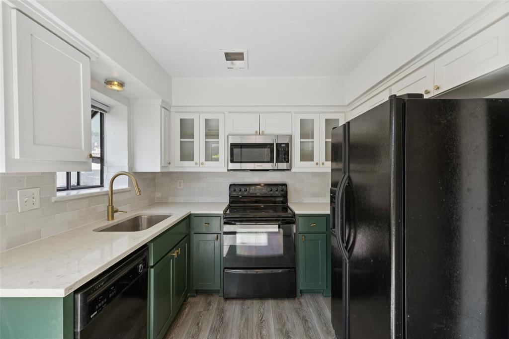 5200 Martel Avenue, Unit 36A Dallas, TX 75206 - Photo 9 of 34 a kitchen with a refrigerator sink and stainless steel appliances