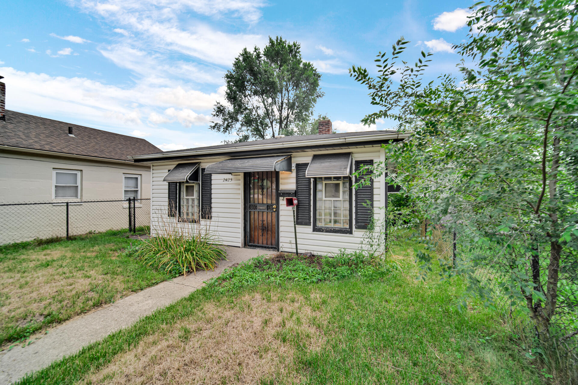 2425 Prospect Street Gary, IN 46407 - Photo 2 of 4 a view of a house with backyard and garden