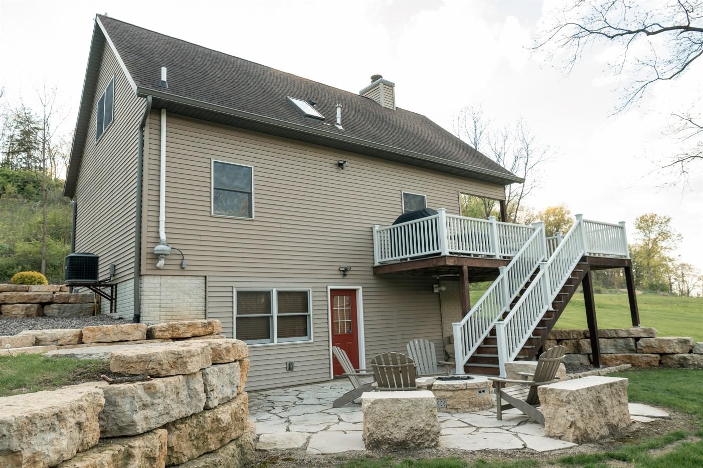 5829 South Pleasant Hill Road Elizabeth, IL 61028 - Photo 6 of 68 a view of a house with a wooden deck