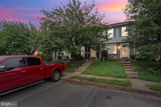 a view of a house with a cars park
