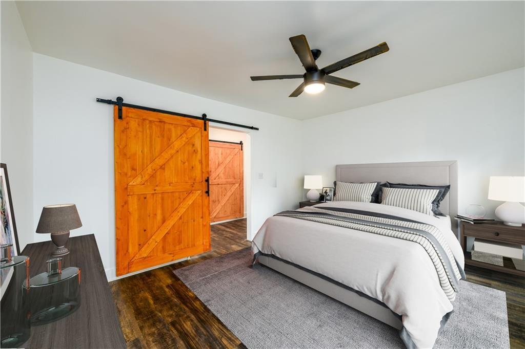 1285 Avon Avenue Southwest Atlanta, GA 30310 - Photo 12 of 28 a bedroom with a bed and a large window