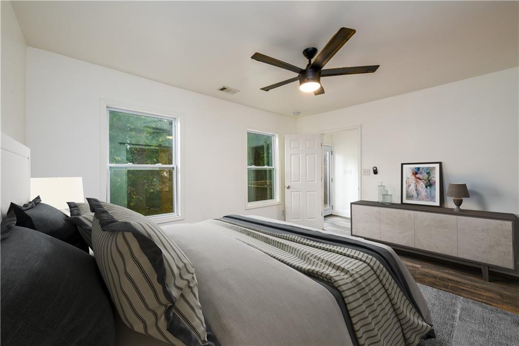 1285 Avon Avenue Southwest Atlanta, GA 30310 - Photo 13 of 28 a bedroom with a large bed and a window