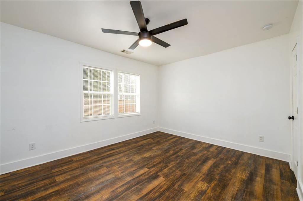 1285 Avon Avenue Southwest Atlanta, GA 30310 - Photo 16 of 28 wooden floor in an empty room with a window