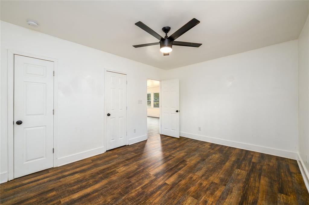 1285 Avon Avenue Southwest Atlanta, GA 30310 - Photo 17 of 28 an empty room with wooden floor and windows