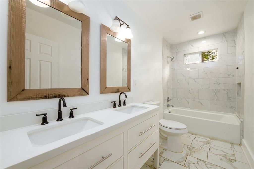 1285 Avon Avenue Southwest Atlanta, GA 30310 - Photo 19 of 28 a bathroom with a sink a toilet and bathtub