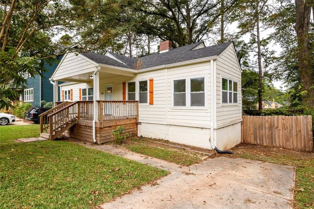 1285 Avon Avenue Southwest Atlanta, GA 30310 - Photo 2 of 28 a view of a house with a yard and wooden fence