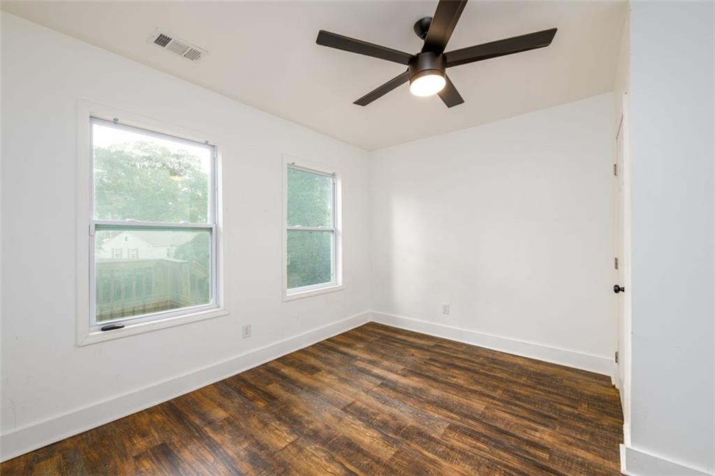 1285 Avon Avenue Southwest Atlanta, GA 30310 - Photo 21 of 28 a view of empty room with wooden floor and fan