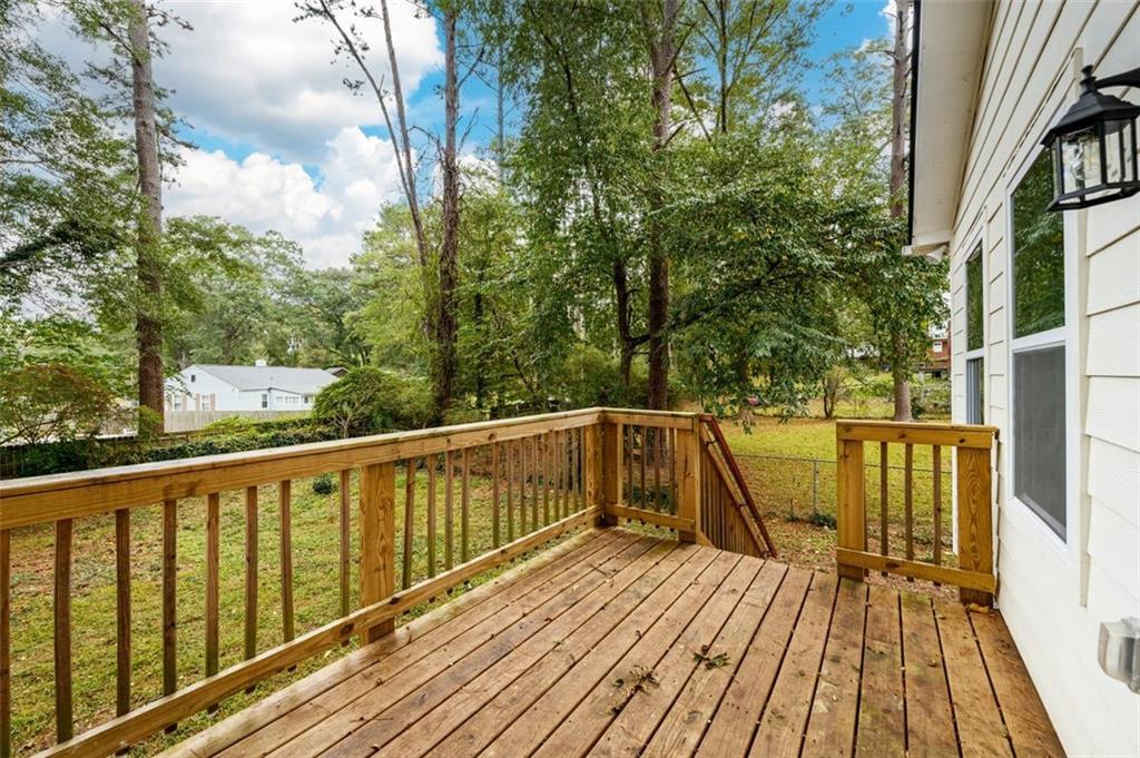 1285 Avon Avenue Southwest Atlanta, GA 30310 - Photo 24 of 28 a view of balcony with wooden floor and fence