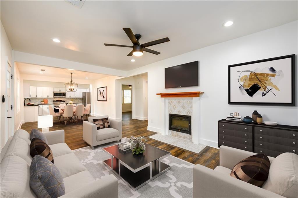 1285 Avon Avenue Southwest Atlanta, GA 30310 - Photo 10 of 28 a living room with furniture fireplace and a flat screen tv