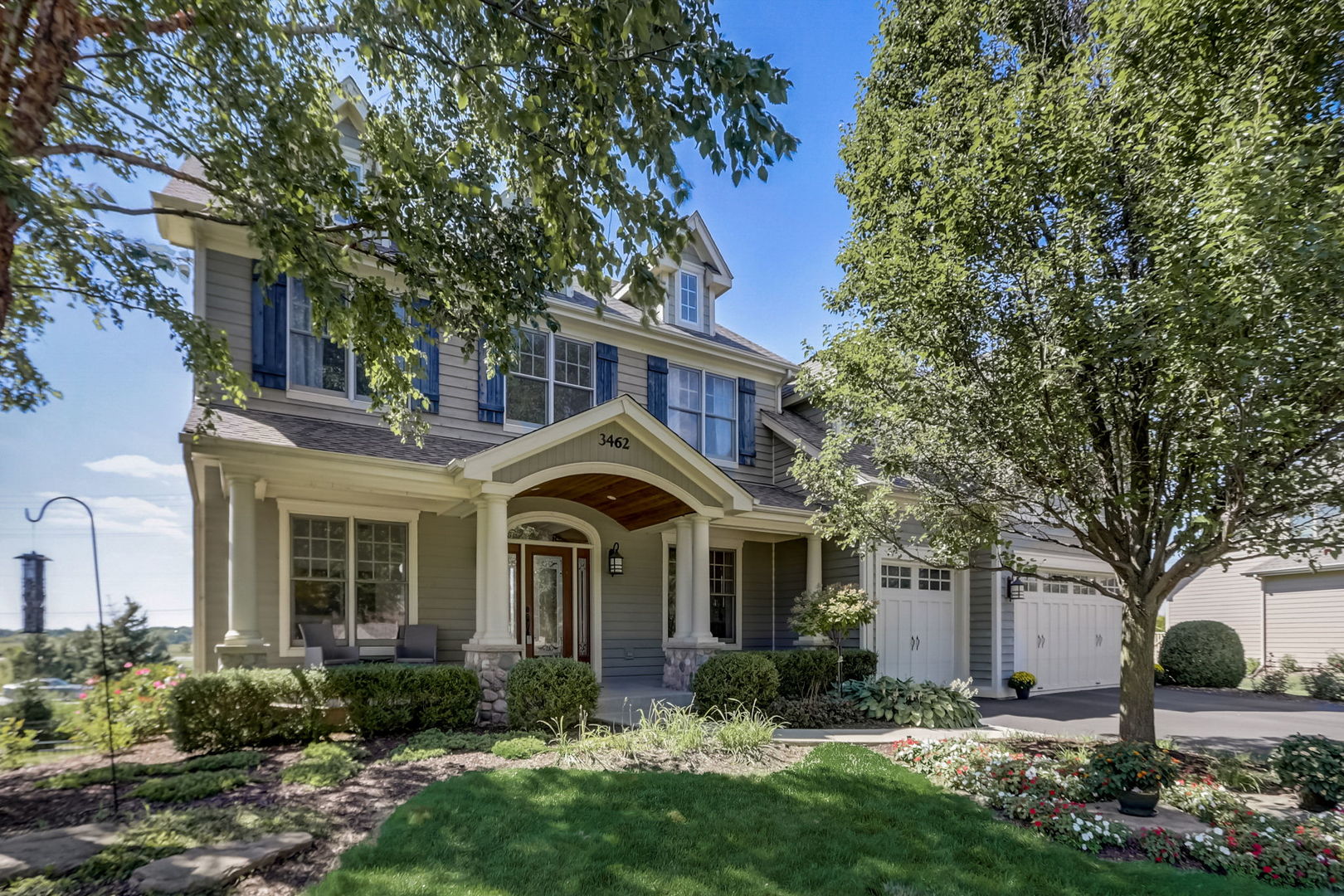 3462 Wild Prairie Lane Geneva, IL 60134 - Photo 1 of 59 a front view of a house with garden