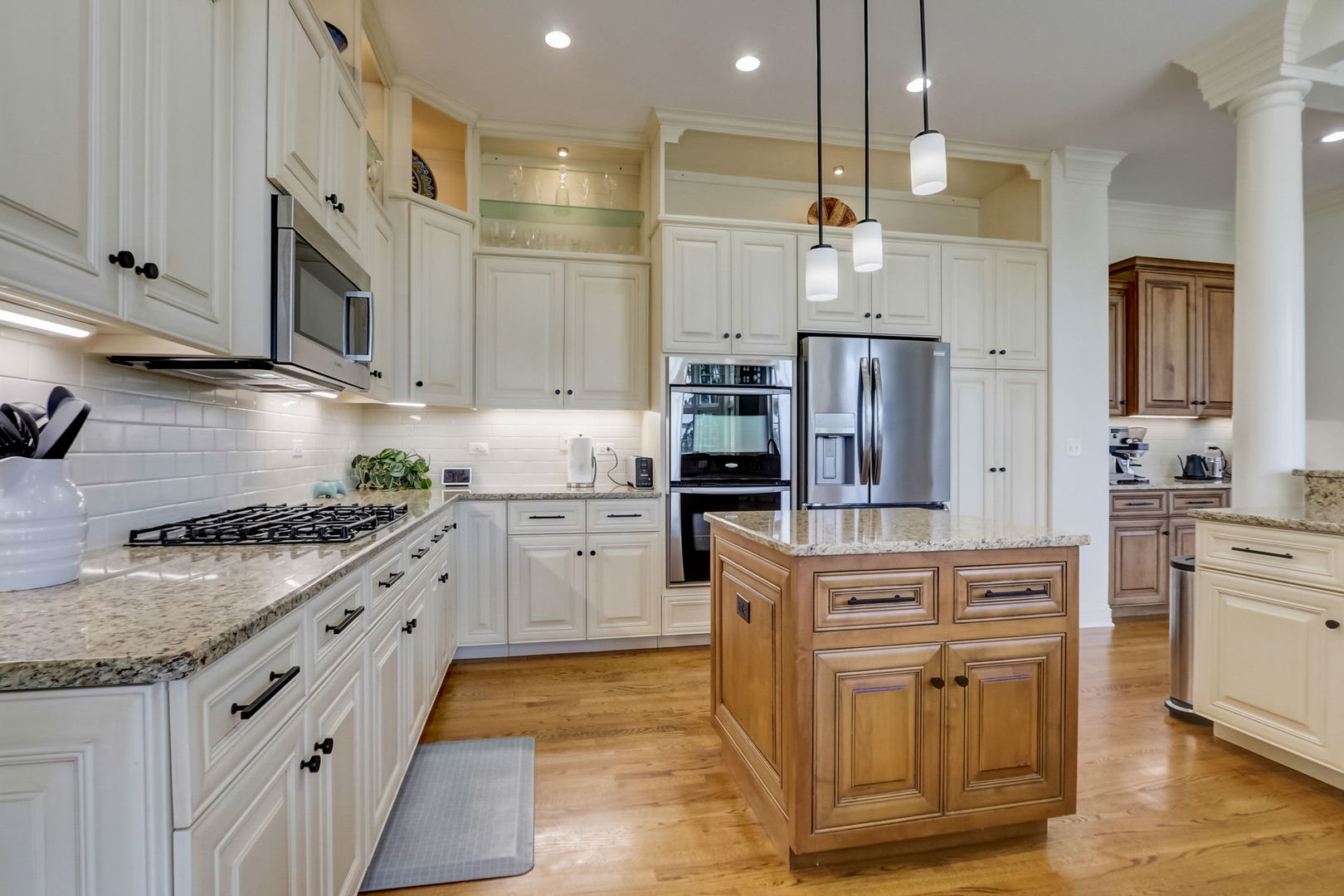 3462 Wild Prairie Lane Geneva, IL 60134 - Photo 12 of 59 a kitchen with stainless steel appliances granite countertop a sink and a stove