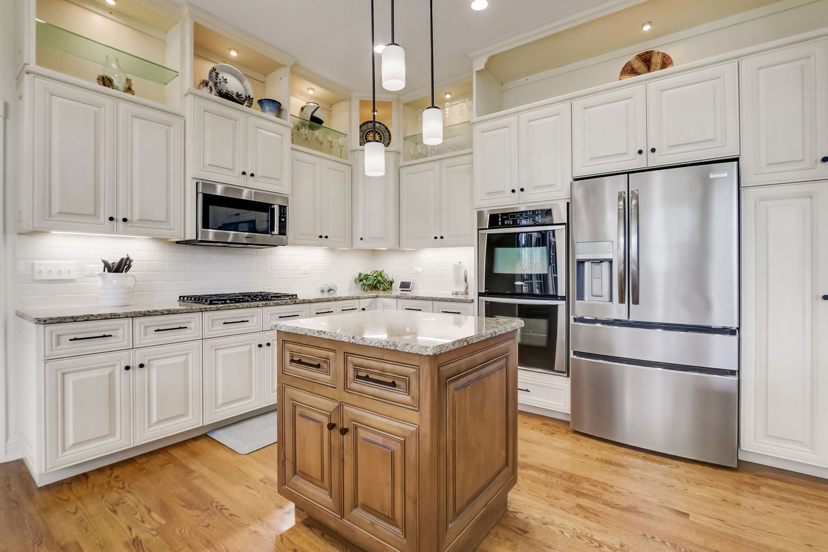 3462 Wild Prairie Lane Geneva, IL 60134 - Photo 13 of 59 a kitchen with stainless steel appliances granite countertop a refrigerator stove a sink and a microwave