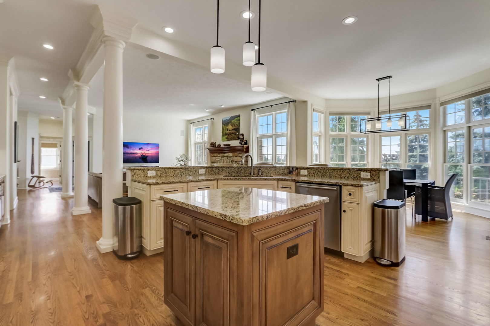 3462 Wild Prairie Lane Geneva, IL 60134 - Photo 14 of 59 a kitchen with stainless steel appliances granite countertop a sink stove and wooden floor