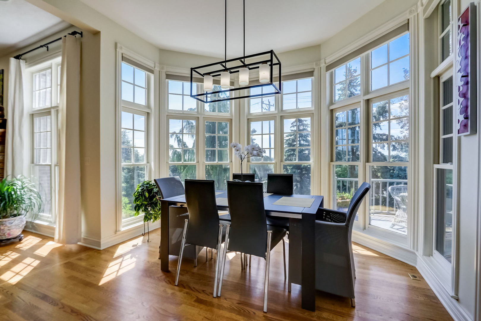 3462 Wild Prairie Lane Geneva, IL 60134 - Photo 18 of 59 a view of a dining room with furniture window and wooden floor
