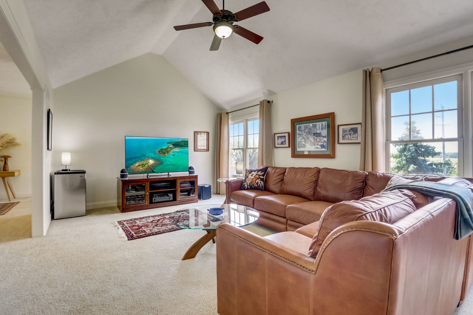 3462 Wild Prairie Lane Geneva, IL 60134 - Photo 34 of 59 a living room with furniture and a flat screen tv