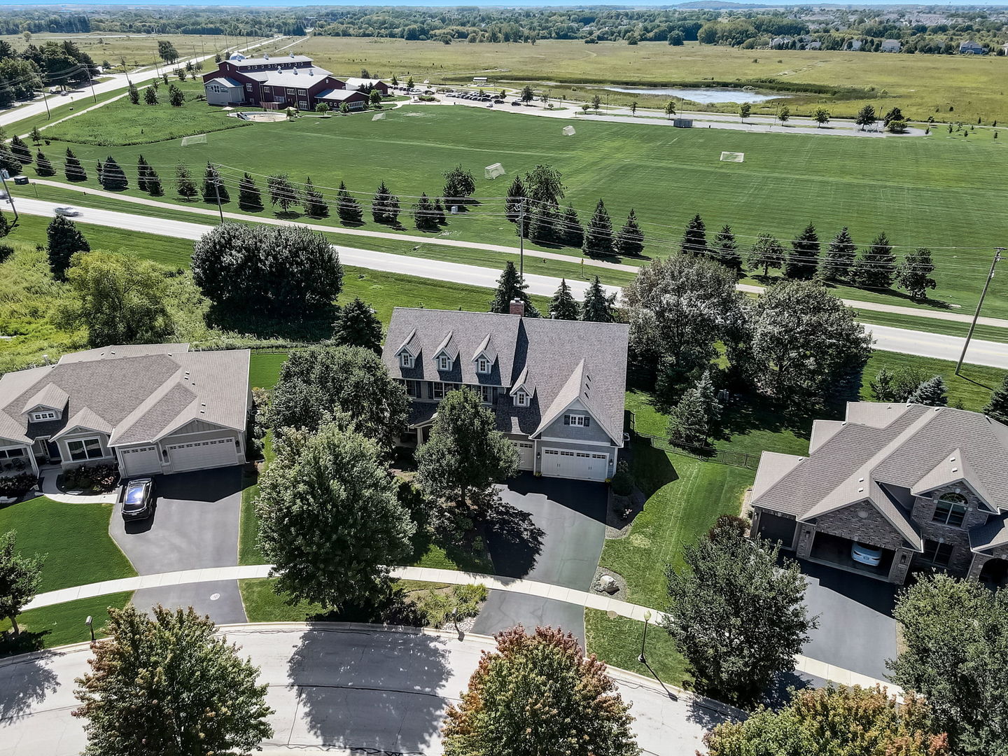 3462 Wild Prairie Lane Geneva, IL 60134 - Photo 49 of 59 an aerial view of a house with a garden and lake view