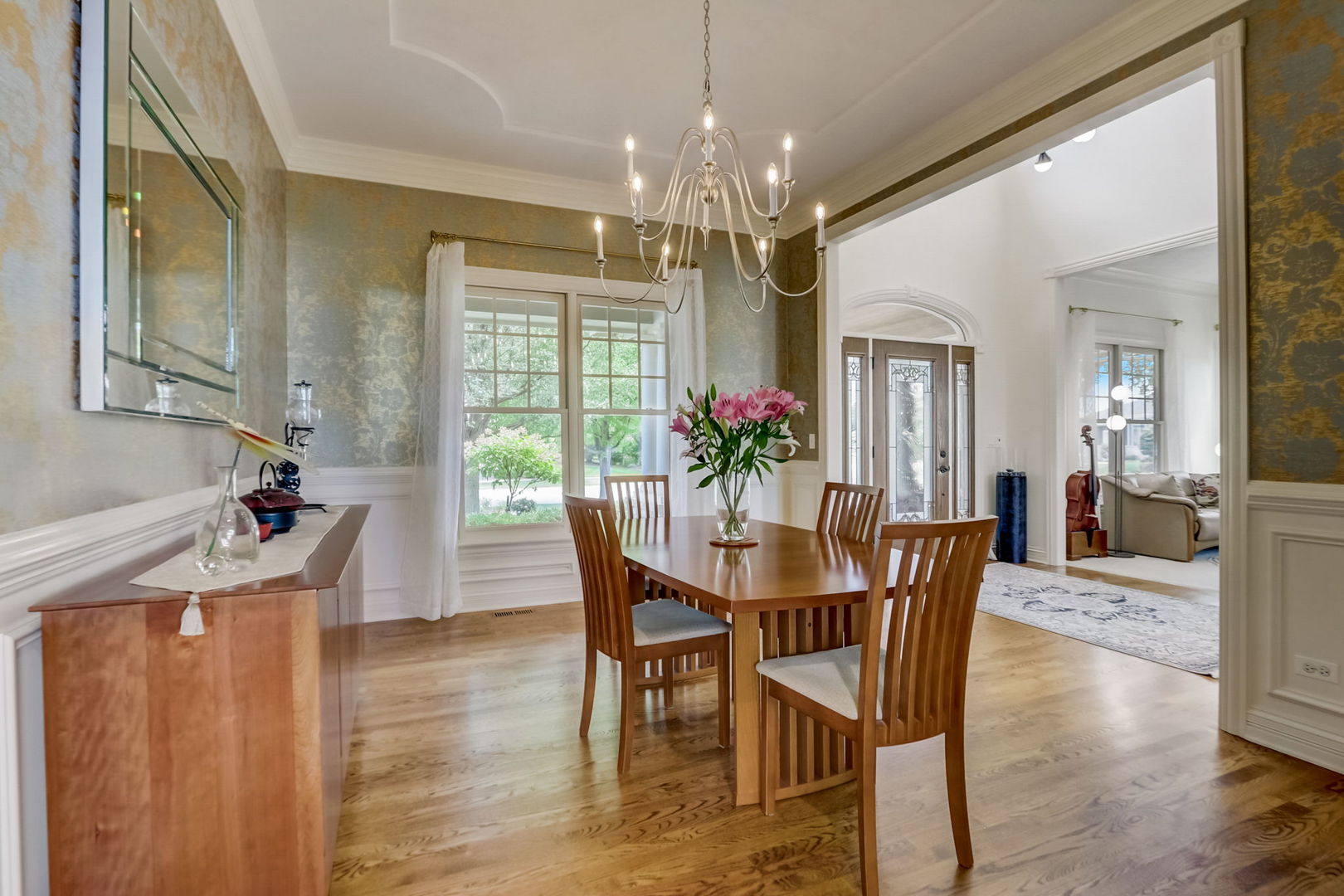 3462 Wild Prairie Lane Geneva, IL 60134 - Photo 7 of 59 a view of a dining room with furniture and chandelier