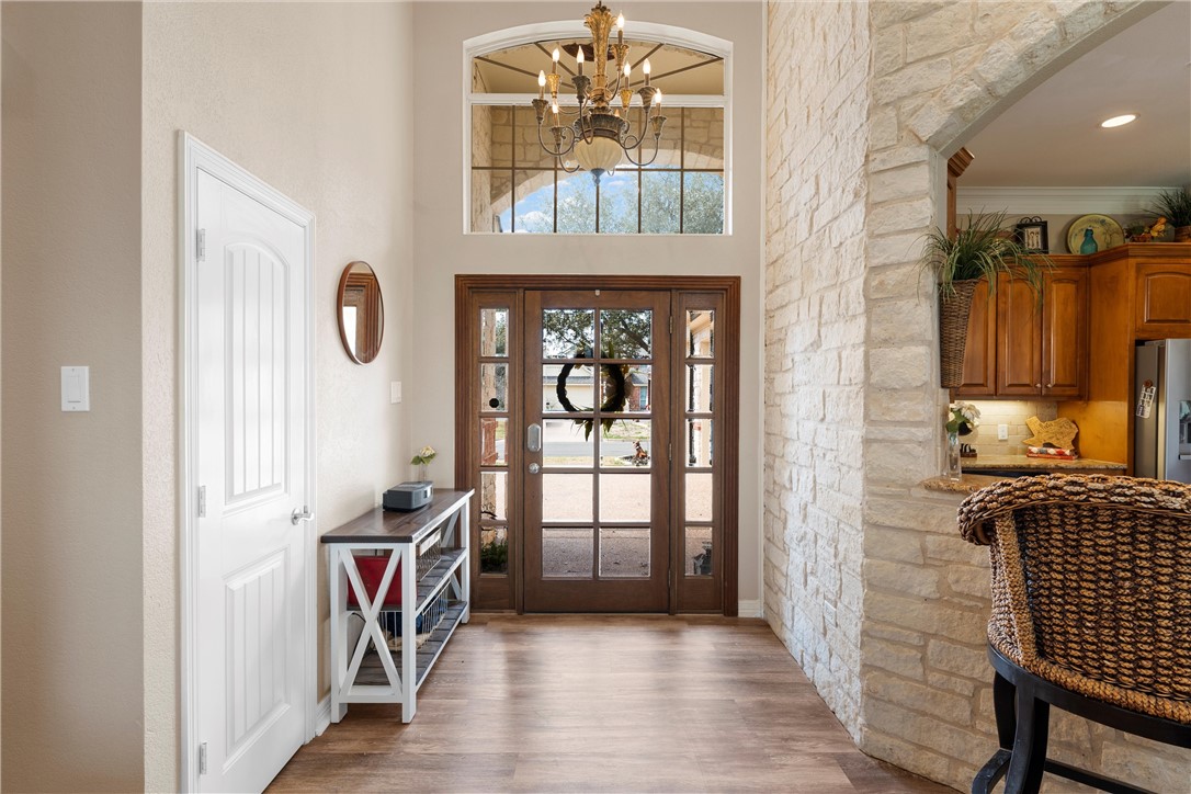 10513 T Bury Lane Waco, TX 76708 - Photo 11 of 36 a view of a hallway with wooden floor and a window