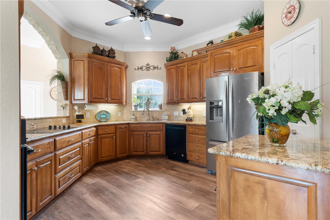 10513 T Bury Lane Waco, TX 76708 - Photo 13 of 36 a kitchen with stainless steel appliances a sink stove and refrigerator