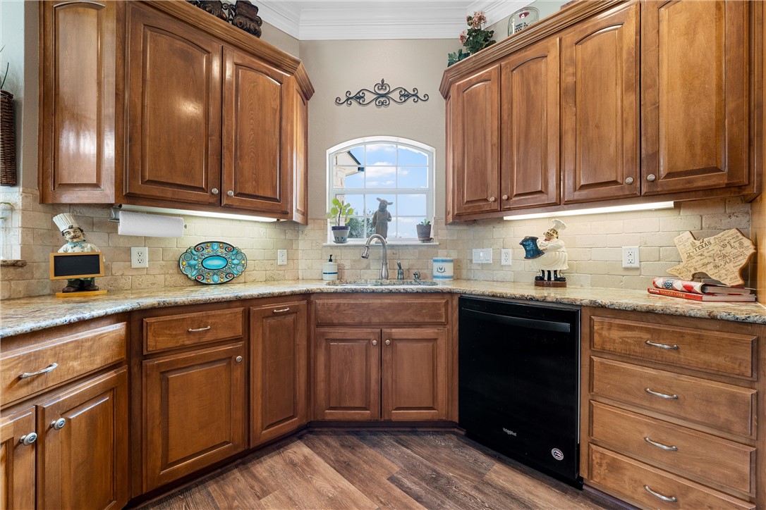 10513 T Bury Lane Waco, TX 76708 - Photo 14 of 36 a kitchen with cabinets a sink and appliances