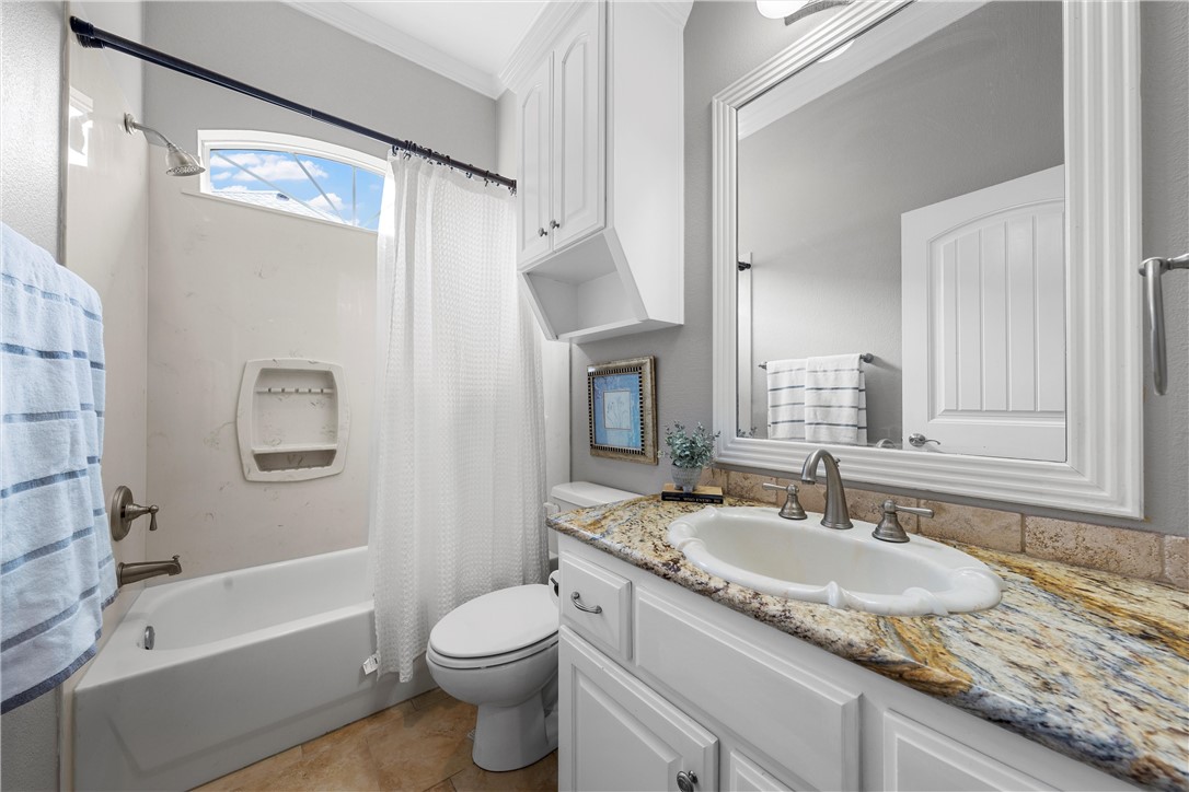 10513 T Bury Lane Waco, TX 76708 - Photo 24 of 36 a bathroom with a granite countertop sink toilet and shower