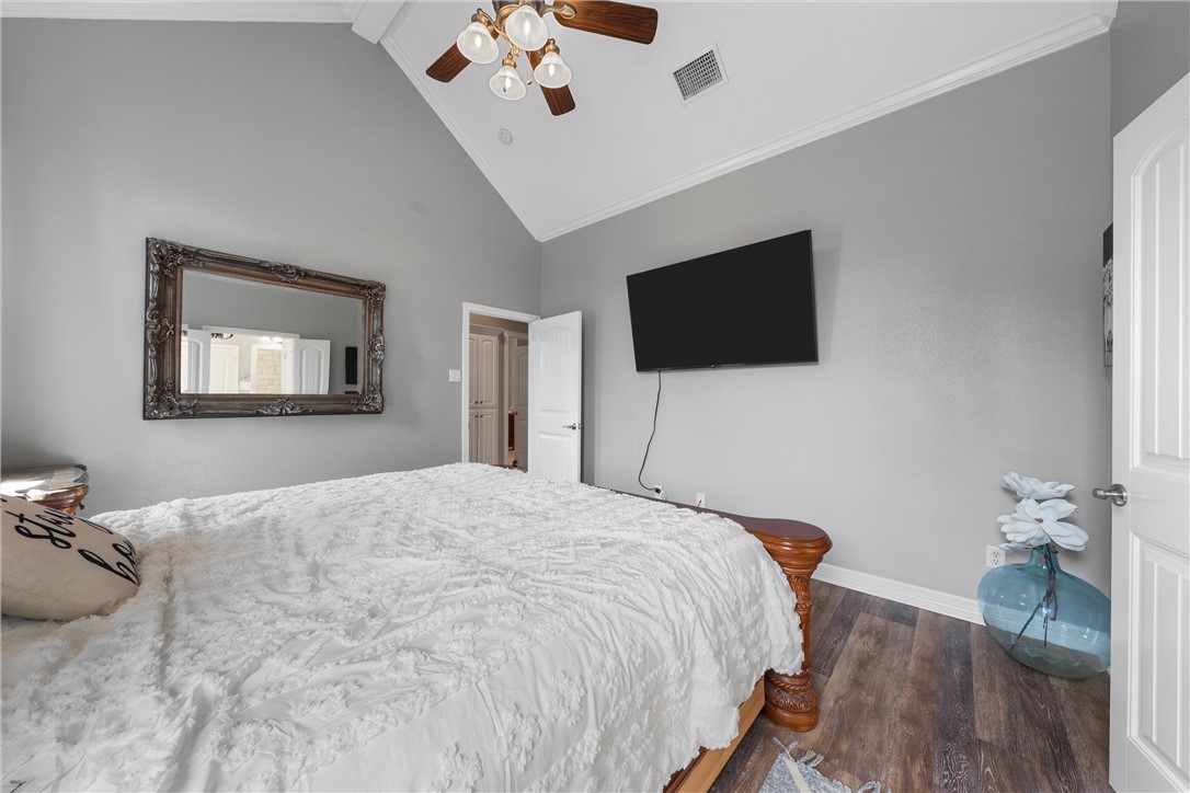 10513 T Bury Lane Waco, TX 76708 - Photo 26 of 36 a bedroom with a bed and a flat screen tv