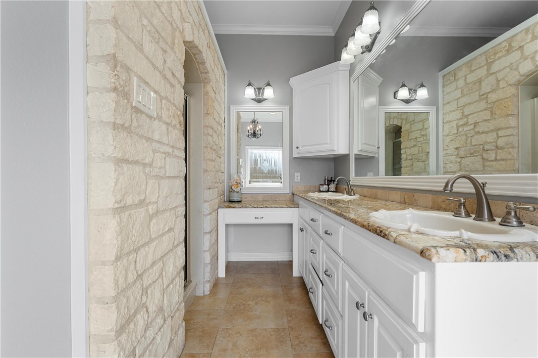 10513 T Bury Lane Waco, TX 76708 - Photo 28 of 36 a bathroom with a granite countertop double vanity sink and mirror