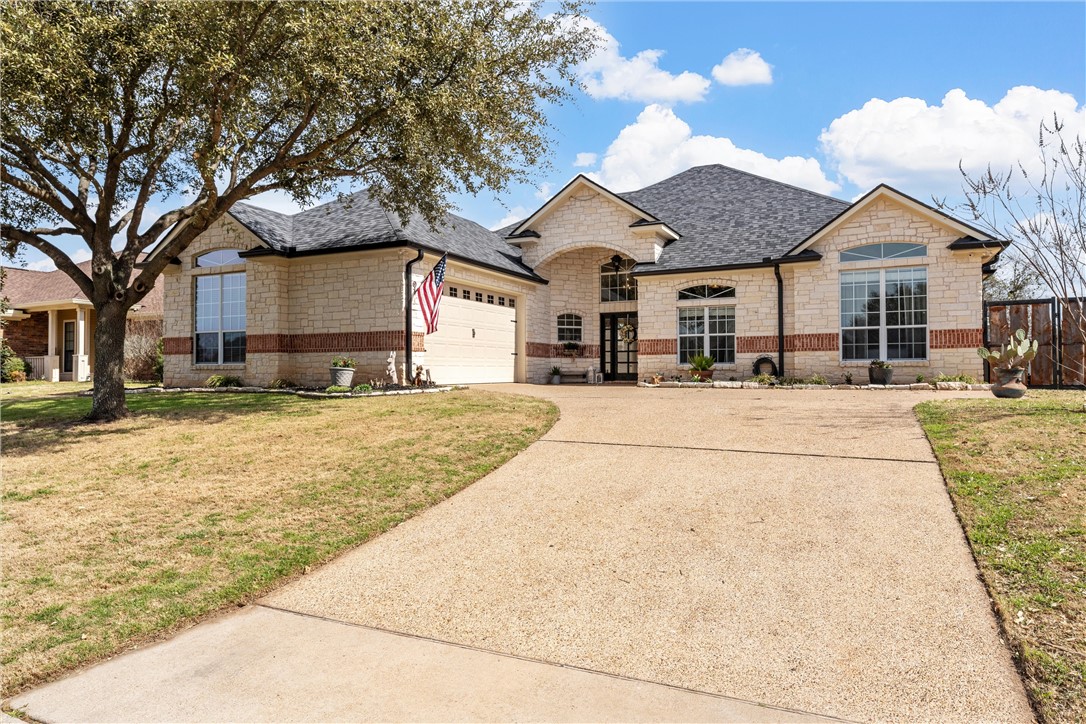 10513 T Bury Lane Waco, TX 76708 - Photo 3 of 36 a view of a white house with a yard covered in snow