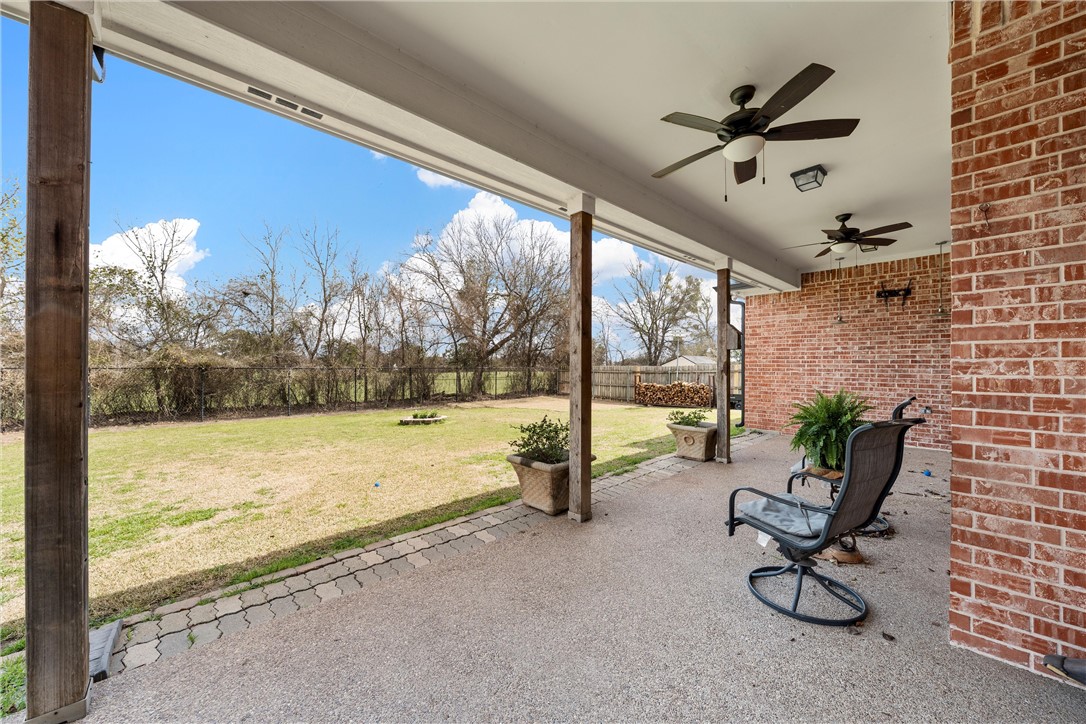 10513 T Bury Lane Waco, TX 76708 - Photo 32 of 36 a view of a living room and floor to ceiling window and an kitchen