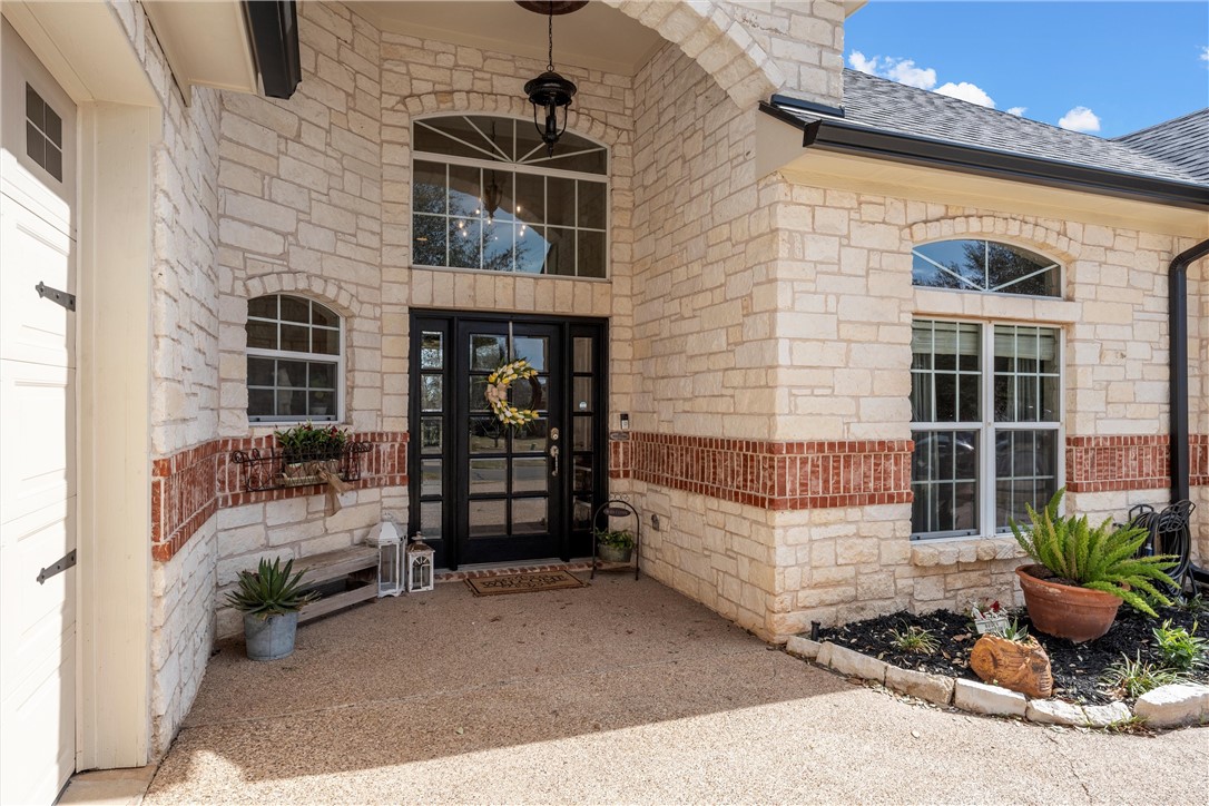 10513 T Bury Lane Waco, TX 76708 - Photo 4 of 36 a front view of a house with outdoor space