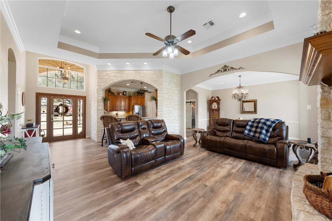 10513 T Bury Lane Waco, TX 76708 - Photo 5 of 36 a living room with furniture ceiling fan and a rug