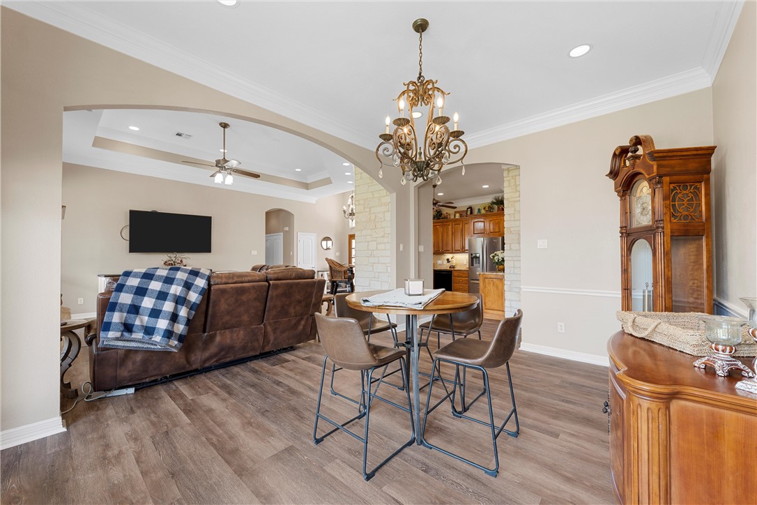 10513 T Bury Lane Waco, TX 76708 - Photo 7 of 36 a living room with furniture and a chandelier