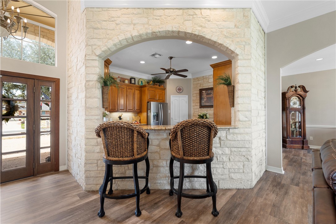 10513 T Bury Lane Waco, TX 76708 - Photo 9 of 36 a view of hall way with furniture and chandelier