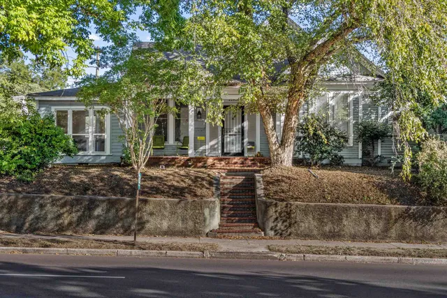 a view of a house with a tree