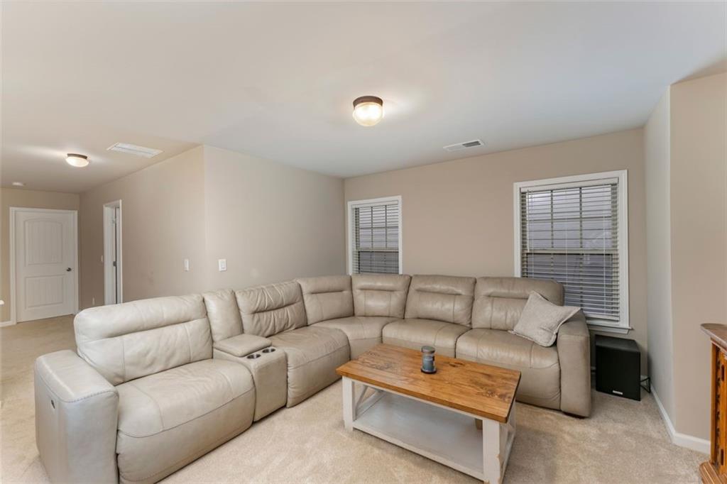 113 Tyson Woods Road Acworth, GA 30102 - Photo 28 of 37 a living room with furniture and a couch