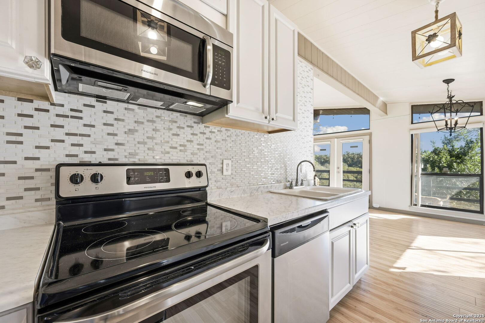 3119 Tanglewood Trail Spring Branch, TX 78070 - Photo 11 of 41 a kitchen with a stove and a microwave