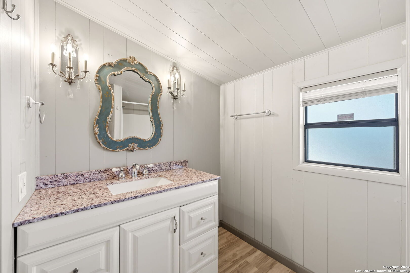 3119 Tanglewood Trail Spring Branch, TX 78070 - Photo 14 of 41 a bathroom with a granite countertop sink a mirror and a vanity