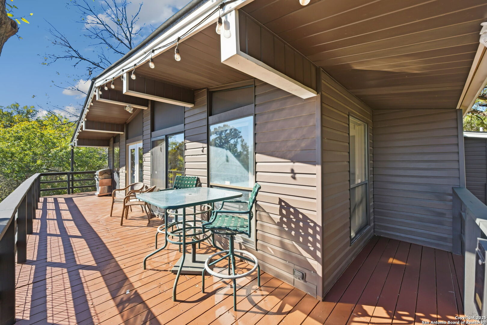 3119 Tanglewood Trail Spring Branch, TX 78070 - Photo 20 of 41 a view of balcony with wooden floor and outdoor seating