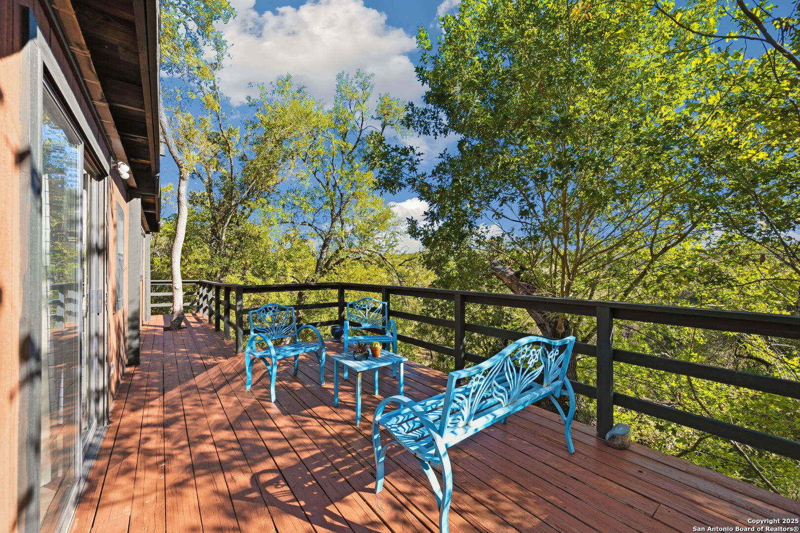 3119 Tanglewood Trail Spring Branch, TX 78070 - Photo 22 of 41 a balcony with couple of chairs and wooden fence