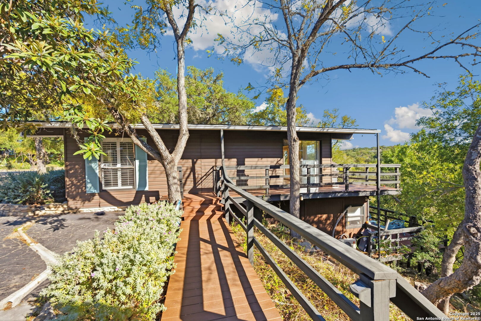 3119 Tanglewood Trail Spring Branch, TX 78070 - Photo 28 of 41 a view of balcony with wooden floor and seating space