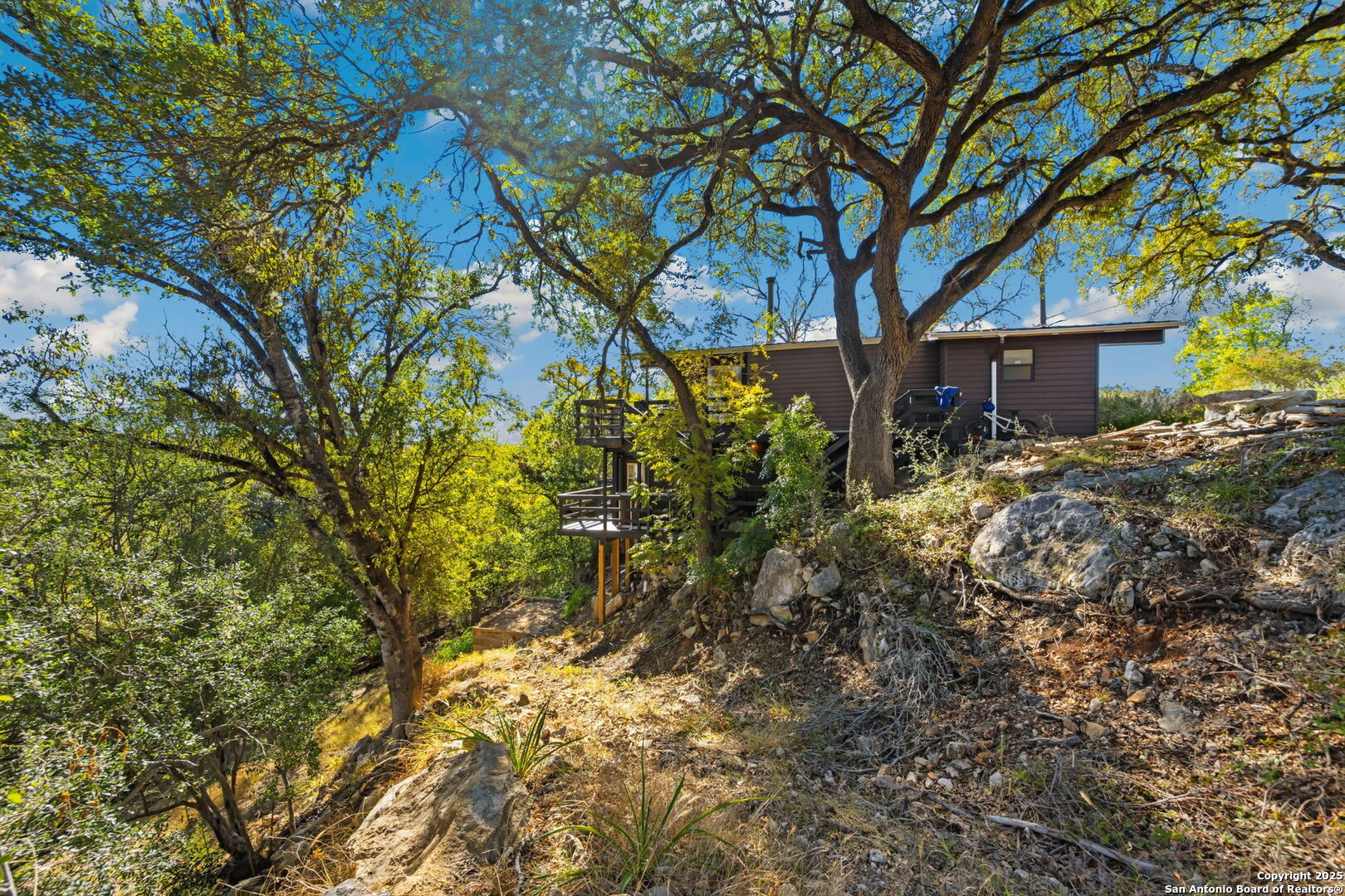 3119 Tanglewood Trail Spring Branch, TX 78070 - Photo 31 of 41 a view of a house with a tree