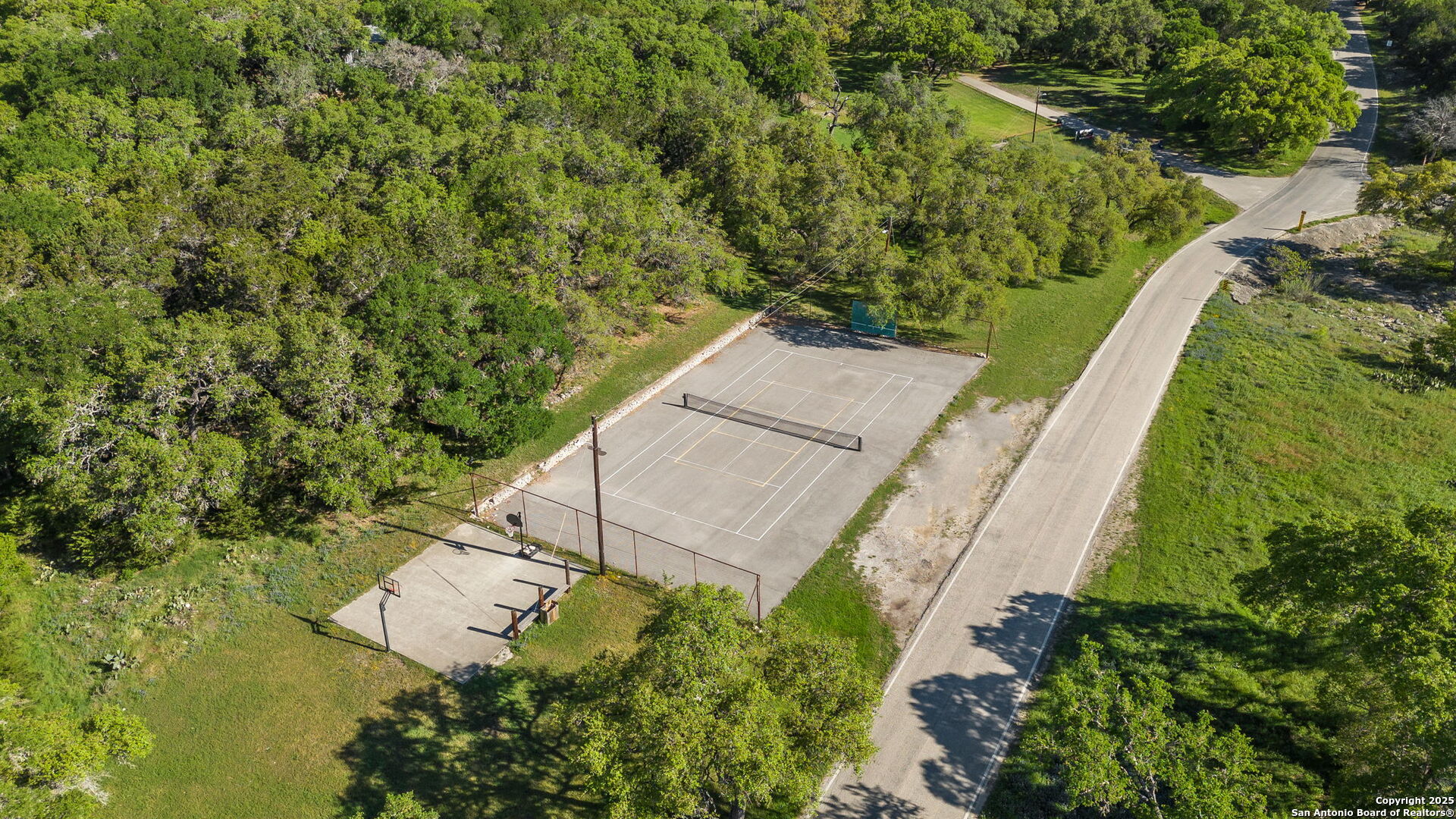 3119 Tanglewood Trail Spring Branch, TX 78070 - Photo 38 of 41 an aerial view of a house with a yard and outdoor seating