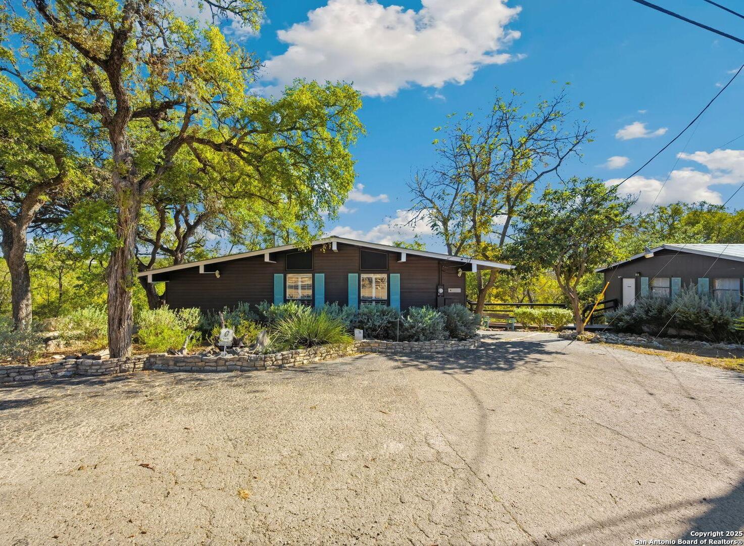 3119 Tanglewood Trail Spring Branch, TX 78070 - Photo 5 of 41 a front view of a house with a yard