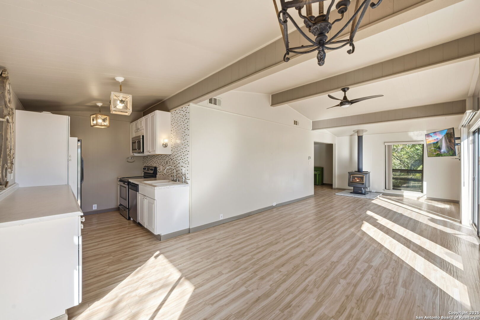3119 Tanglewood Trail Spring Branch, TX 78070 - Photo 9 of 41 a view of a living room and kitchen with furniture