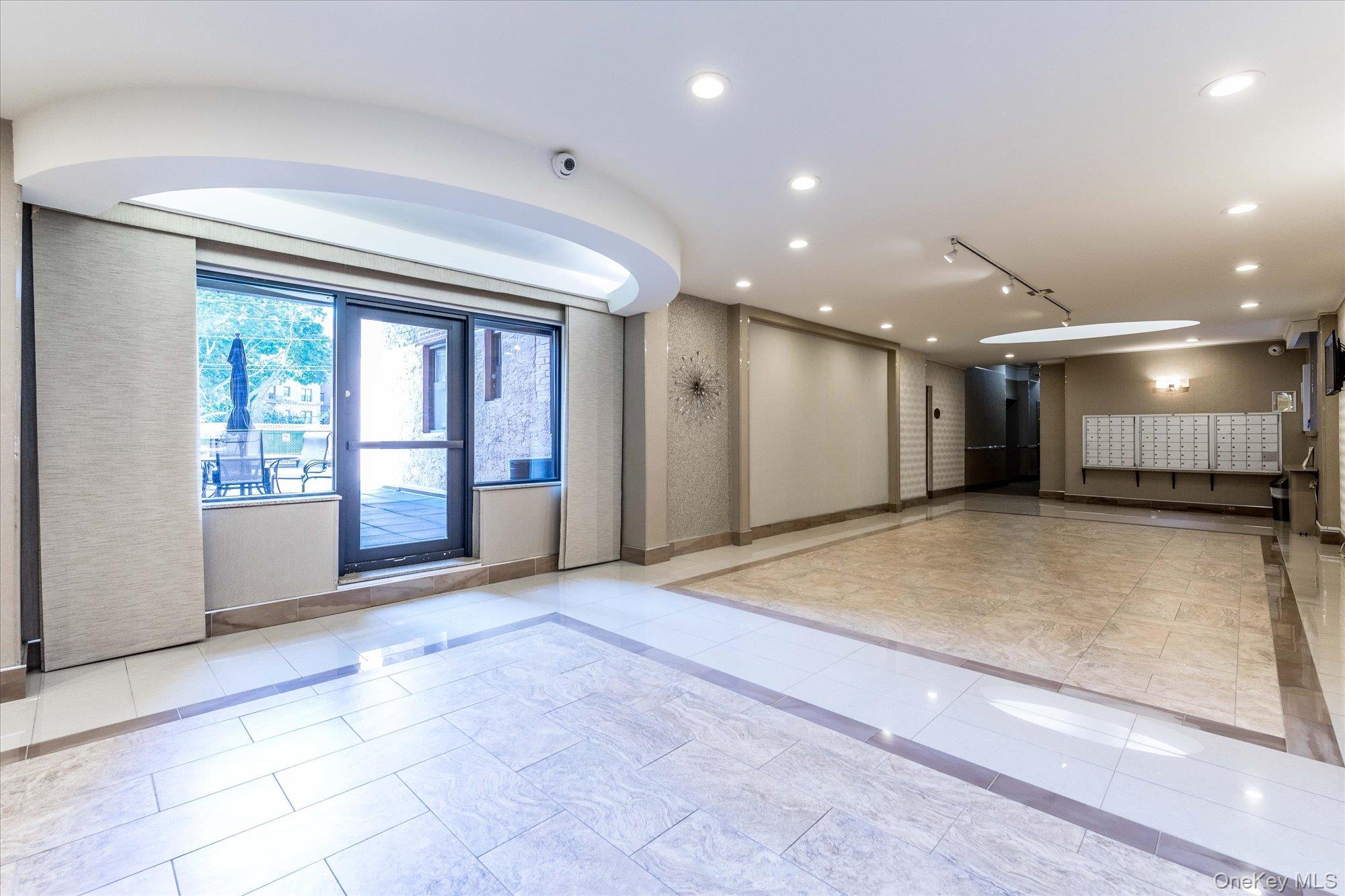 83-40 Austin Street, Unit 7K Queens, NY 11415 - Photo 13 of 19 a view of an empty room with a window